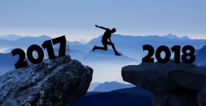 man jumping between 2017 and 2018