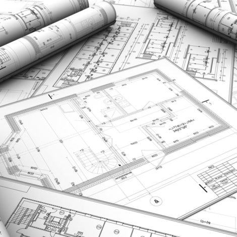 A stack of blueprints for a new building design