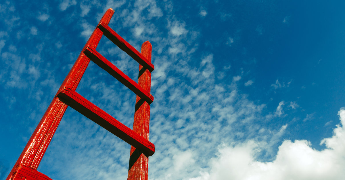 red ladder outside blue sky