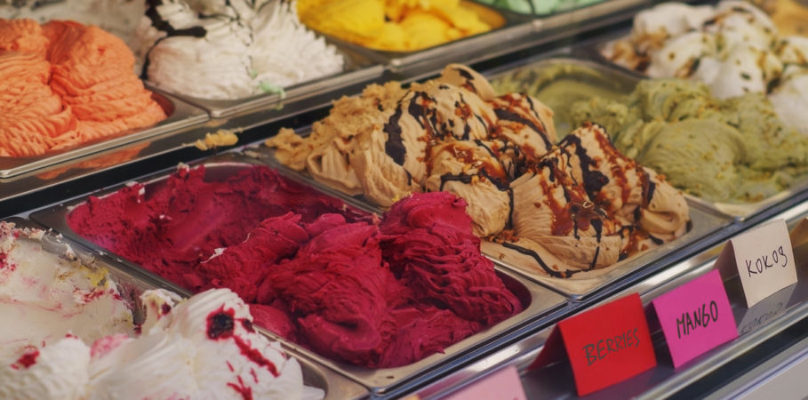 Various ice cream flavors displayed in a case