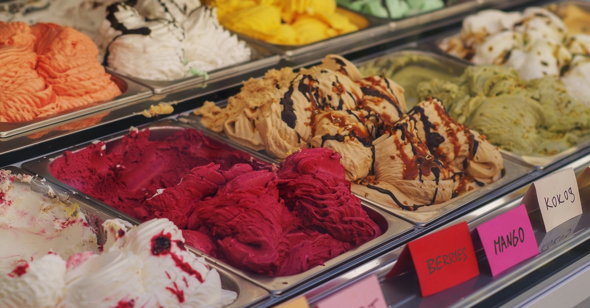 Various ice cream flavors displayed in a case