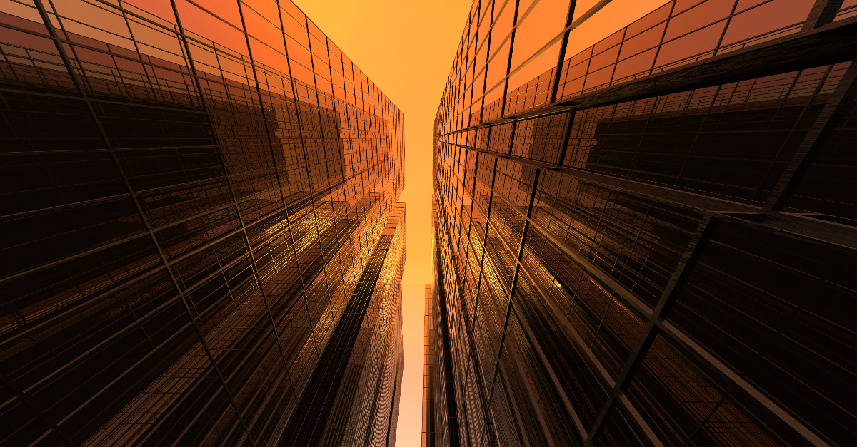 modern high rise buildings against the red sky.