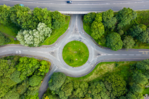 Aerial view of a roundabout with three main roads intersecting. 