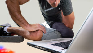 AI generated image of a man in workout clothes looking at a laptop. One leg is missing, the other bent at an odd angle with a shortened torso and an arm bend backwards. It's not right.