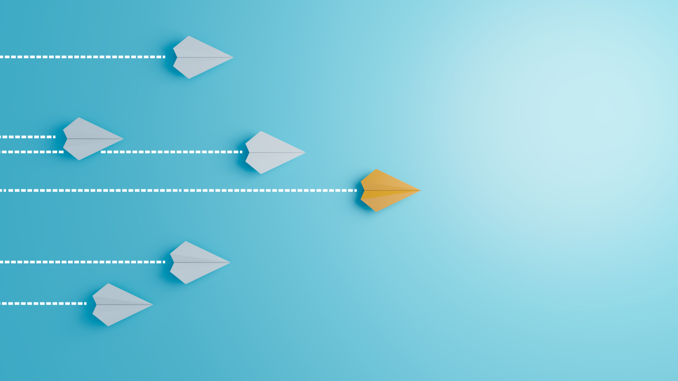 Light blue background with white paper airplanes flying left to right and one yellow airplane flying farther than the rest.